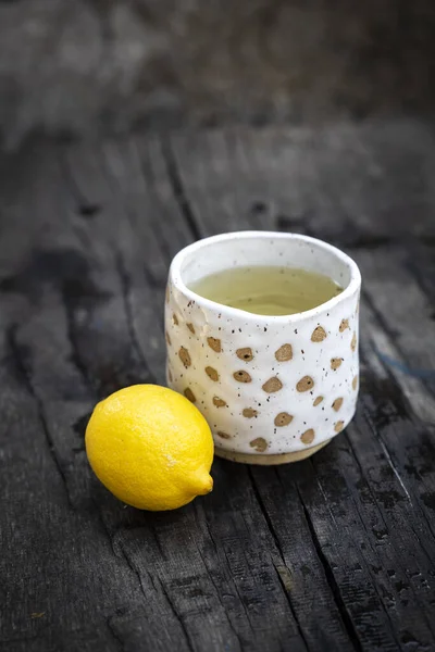 Ceramic Cup with lemon tea copy space