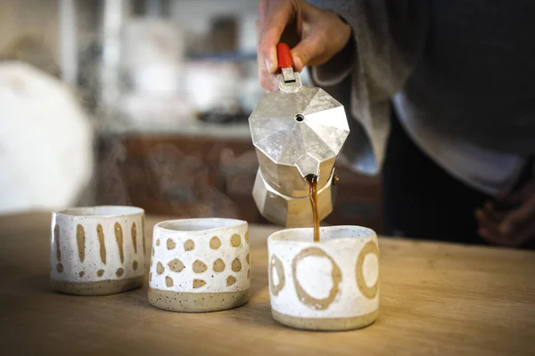 Serving Coffee into Handmade Ceramic Art cups