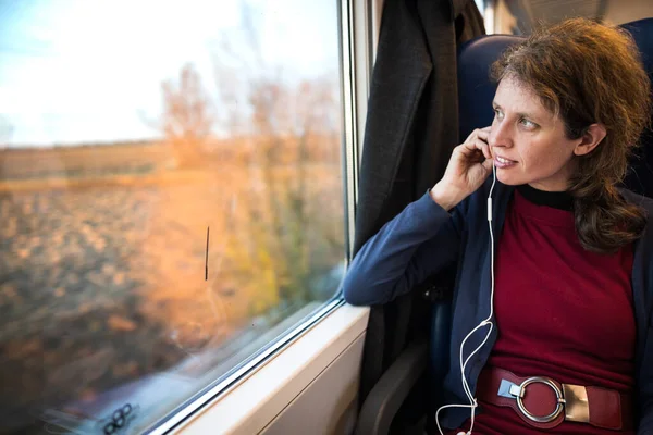 Tranquility of Train Travel for Serene Adult Caucasian Woman Tourist