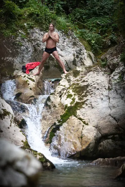 Breathing Exercises of an Adult Caucasian Man Between One Cold Bath and Another in Mountain Wilderness Environment