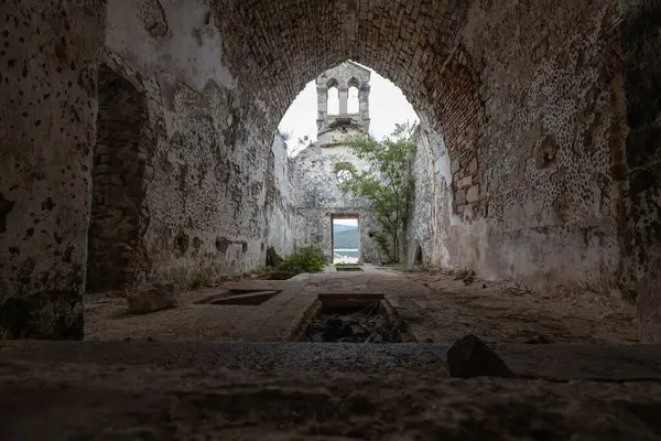 Profaned Empty Tombs Indoors Ruins of ancient Monastery of Saint Marry of the Angels - Osor , Cres Island Croatia