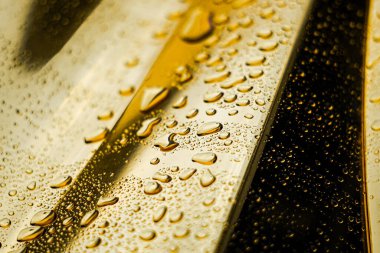 Damlacıklı altın soyut arkaplan. 