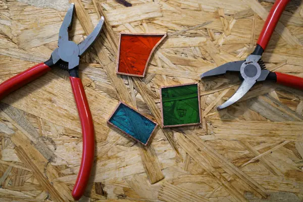 stock image Pieces of colorful glass. Stained glass workshop. 