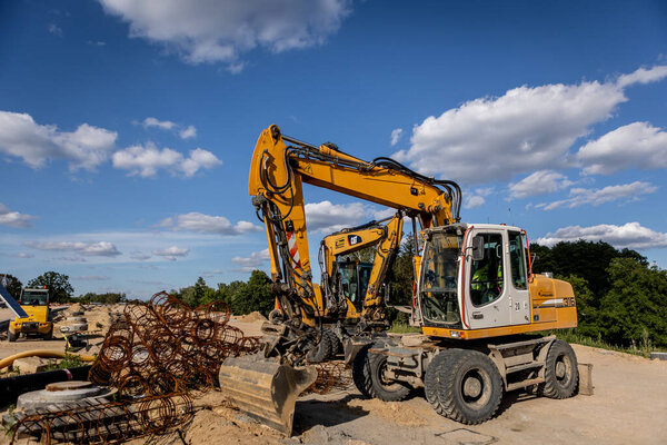 Road building. Highway construction and machines used for construction. Excavator, bulldozer, roller