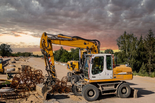 Highway construction. The process of building a highway. Equipment tools and machines used in road construction
