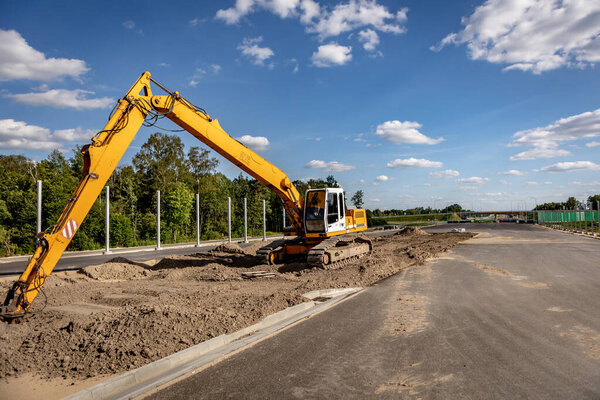 Highways. Highway construction site. Construction machines on the road construction site.