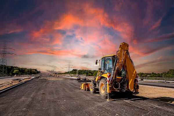 Highways. Highway construction site. Construction machines on the road construction site.