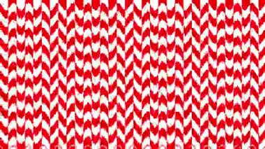 Canlı kırmızı ve beyaz bir sembole sahip kusursuz bir geometrik desen. Geçmişler, tekstil ve çeşitli yaratıcı projeler için mükemmel..