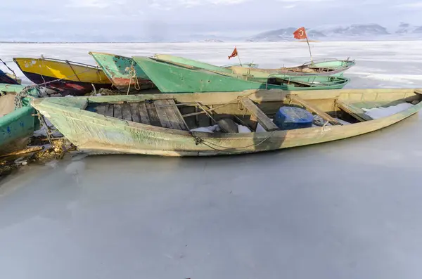 fishing boat on the lake in the winter