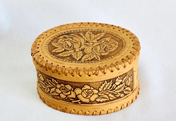 antique handmade birch bark box with an ornament in the form of roses with branches