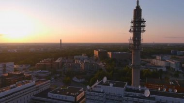 Helsinki.Finland-August 30.2021: Amazing drone point of view of the Tv tower in Helsinki Finland. Awesome architecture. Sunset. Pretty cityscape. Camera moving backwards and sideways.