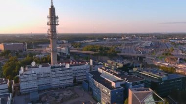 Helsinki.Finland-August 30.2021: Awesome drone point of view of the Tv tower in Helsinki Finland. Sunset. Scandinavian architecture. Beautiful cityscape. Camera slowly moving forward.