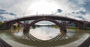 The Old bridge in Maribor city with the river Drava. A panorama view clipart