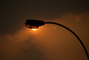 silhouette of a lantern at sunset