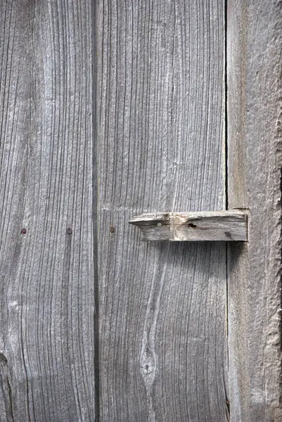 old gray painted wooden door, texture.