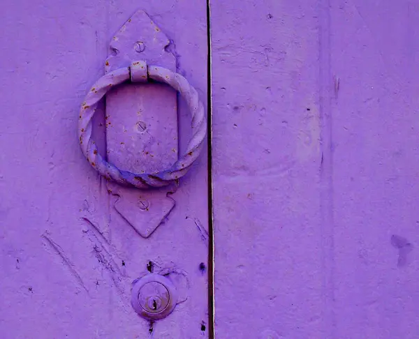 purple door with a white lock