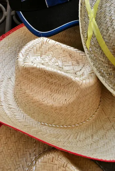 hat, wicker straw and straw bag on a white background