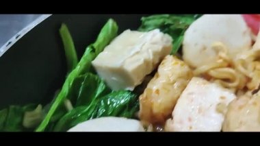 Steamboat is a typical Chinese food that is a favorite of many people in Indonesia.  Steamboat usually has fillings of meat, seafood, tofu, noodles, and various types of vegetables.