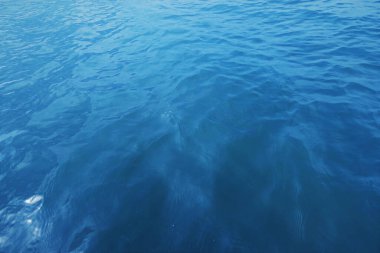 Blue sea water surface texture background. Blue sea water surface with ripples