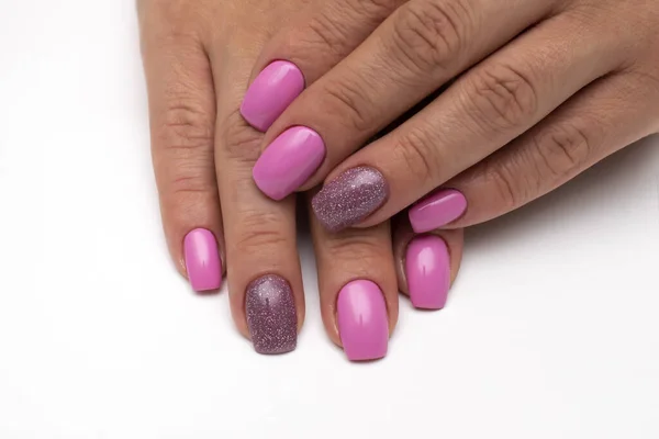 Festive manicure. Pink glitter nail design. Square long nails. Close-up.