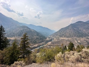 View of the mountains and river in Ashcroft, British Columbia, Canada. clipart