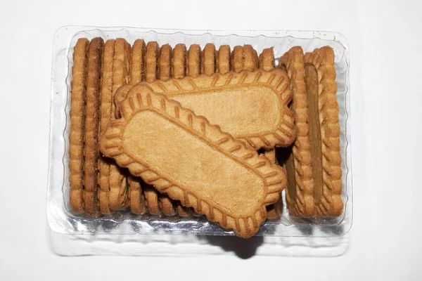 wheat cookies -biscuits packed in plastic case - with isolated white background