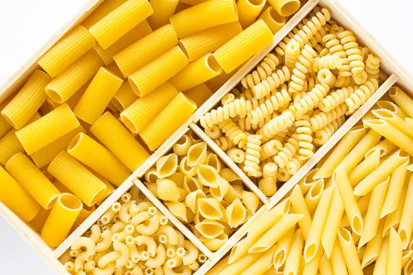 Several types of pasta in a wooden box
