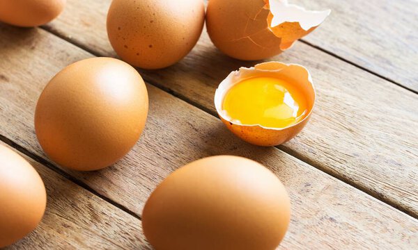 chicken eggs on white background, Fresh orange chicken eggs, concept for healthy cooking and kitchen