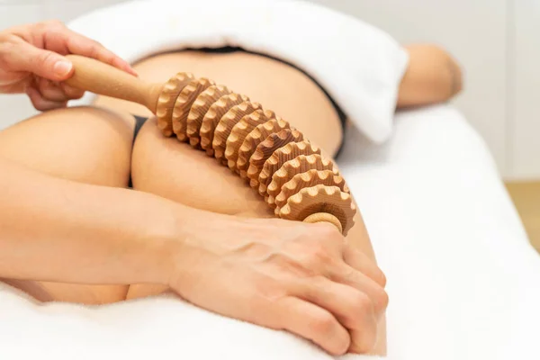 Close up of woman on maderotherapy anticellulite massage treatment at beauty spa salon. High quality photo