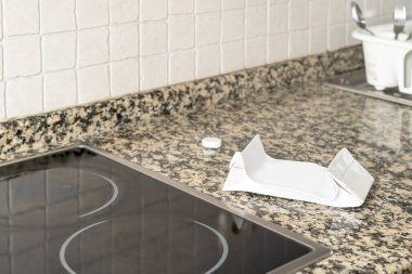 Folded tetra pack container on the stove top ready to be recycled. . High quality photo