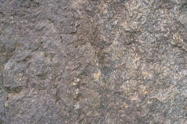Koyu, pürüzlü, taştan bir zemin. Açık renkli damarları var. Yüksek kalite fotoğraf