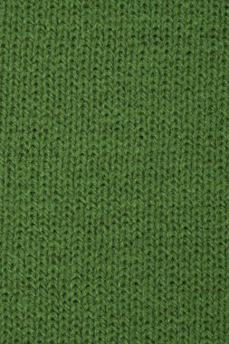 Yeşil yakın çekim dokusu örülmüş yün kumaş arka plan makrosu