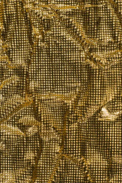 Sparkling gold background texture material metallic foil modern space isolation luxury expensive grid