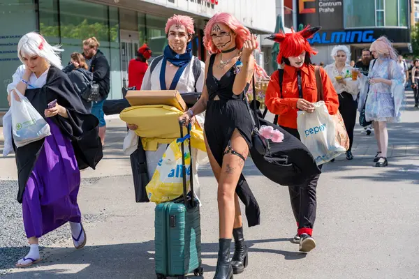 Stock image Prague, Czech Republic - July 28, 2024: Participants leave event with suitcases. Advik festival in Prague, celebrating Japanese pop culture with vibrant anime, manga, computer games characters.