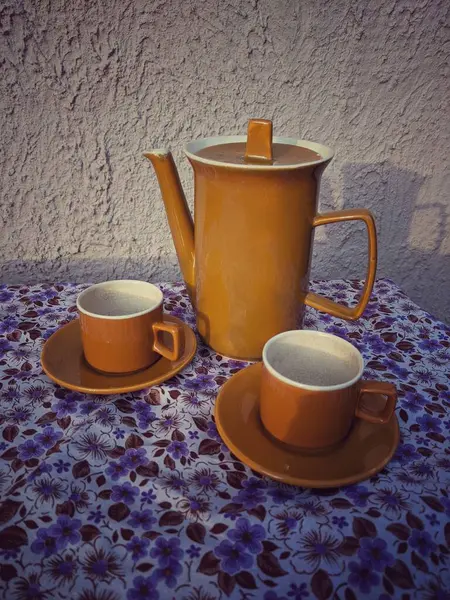 old vintage coffee set on the retro tablecloth