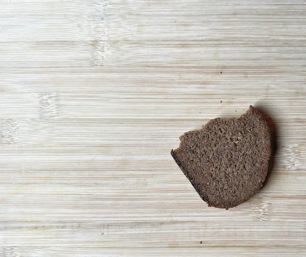 whole grain rye bread on a wooden table