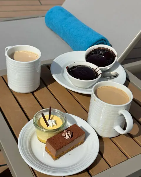 Coffee and cakes on patio furniture on a cruise ship in spring summer
