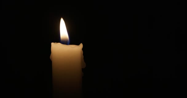 Candle Burns Soft Yellow Flame Isolated Candle Burning Dark Background — Vídeo de Stock