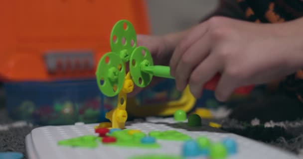 Child Playing Childrens Educational Constructor Puzzle Screwdriver Bolts Screws Multi — Stock Video
