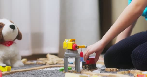Boy Playing Toy Train Wooden Rails While Sitting Floor Home — Stok video