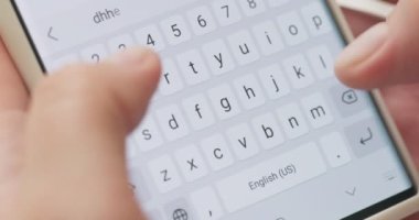 Woman typing a text message on her smartphone. Female hands typing or chatting. High quality 4k footage