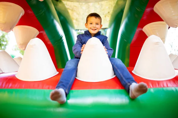 Happy Kid Having Fun Colorful Inflatable Attraction Playground Child Have — Fotografia de Stock