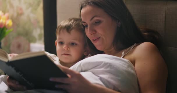 Mother Reading Fairytale Her Lovely Small Son Bed Going Sleep — Stock Video