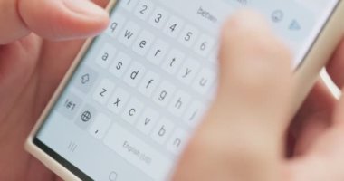 Woman typing a text message on her smartphone. Female hands typing or chatting. High quality 4k footage