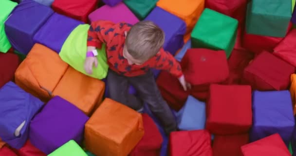 Little Boy Playing Soft Cubes Dry Pool Game Childrens Room — Stock Video
