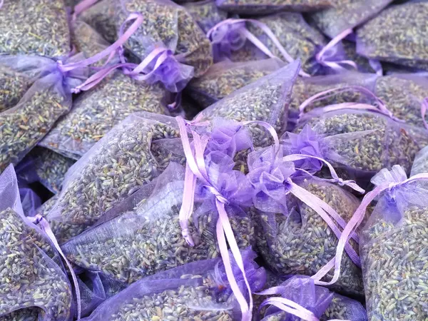 Many purple transparent bags with dried lavender