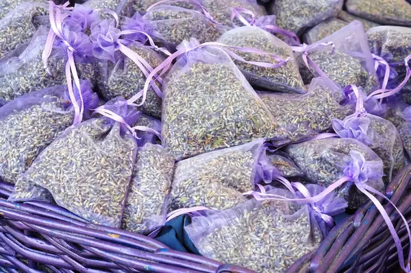 Many purple transparent bags with dried lavender
