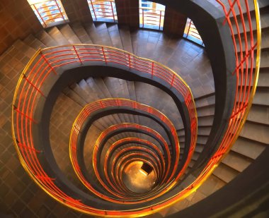 Spiral staircase of the office house in Hamburg named Sprinkenhof in Germany clipart