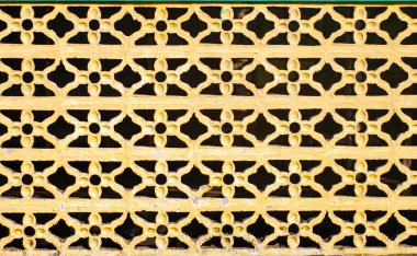 Ev duvarının kare şeklindeki soyut arkaplan dokusu yatay desen oluşturuyor. Çiçek açan sarı renk gibi. Kapatın.