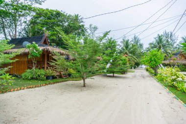 the view and atmosphere of a quiet cottage lodging away from the hustle and bustle of the highway and so private in the bintan area, Indonesia. white sand and clean beaches with beautiful views clipart